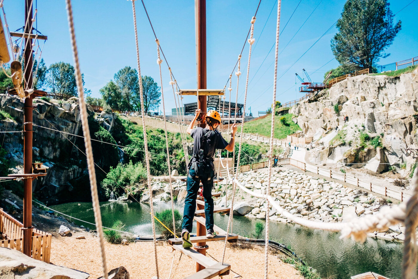 A person is walking on a cable car.